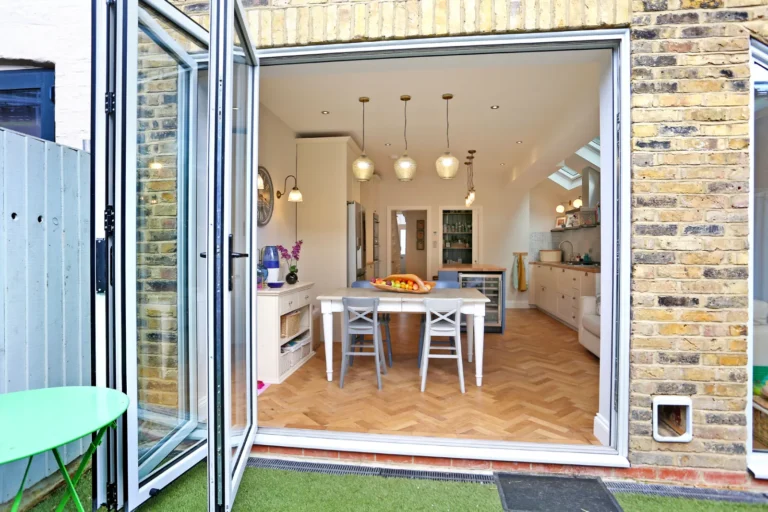Open garden doors looking into the kitchen extension — Chiswick W4