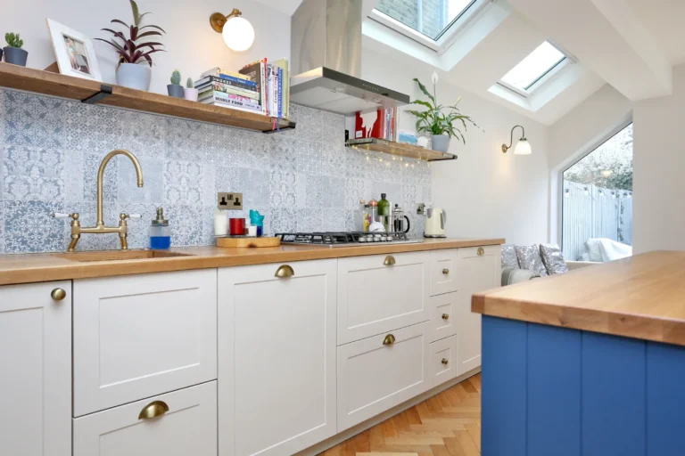 White kitchen units with patterned tiles and timber worktop — Chiswick W4