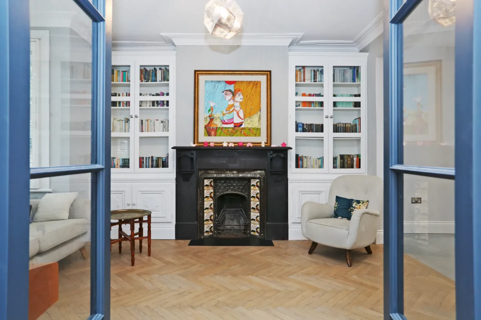 Living room with fireplace and fitted bookshelves — Ealing W5