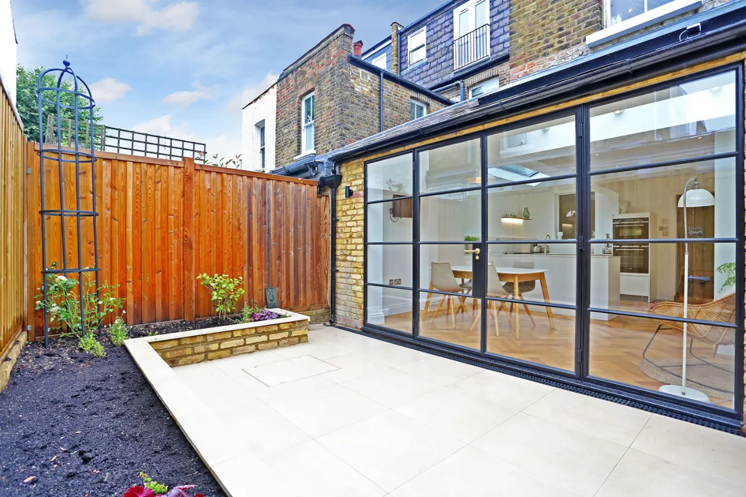 Rear extension glazing beside the courtyard planting bed — Chiswick W4