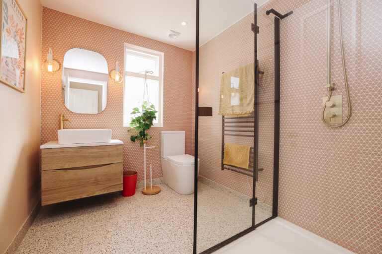 Pink tiled bathroom with walk in shower — Streatham SW16 5BY