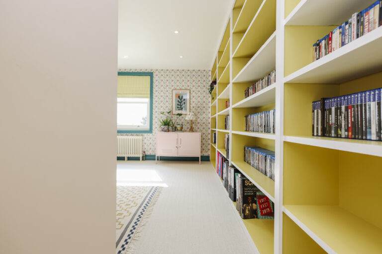 Fitted yellow bookshelves in the loft — Streatham SW16 5BY