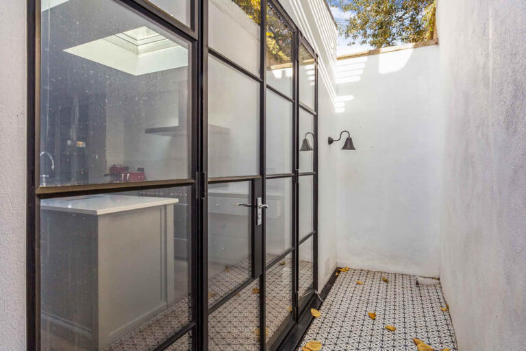 Black framed glazed entrance and tiled floor — Marylebone NW1