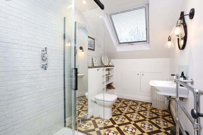 Shower room with patterned floor tiles — Acton W3 9LP