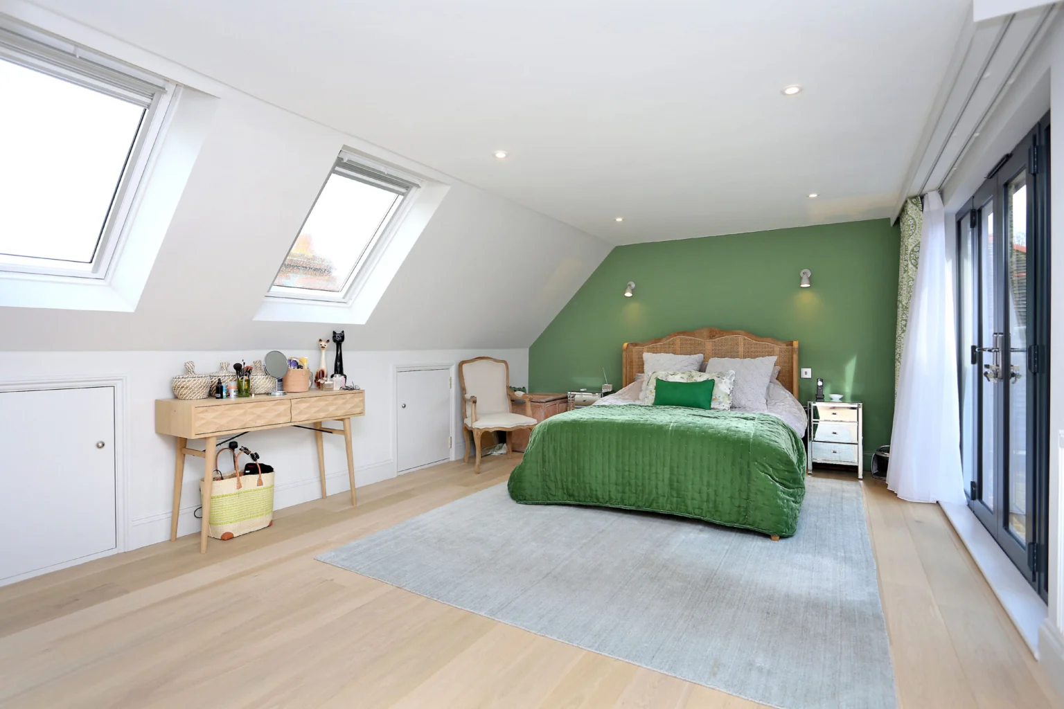 Green loft bedroom with desk and balcony doors — Ealing W13