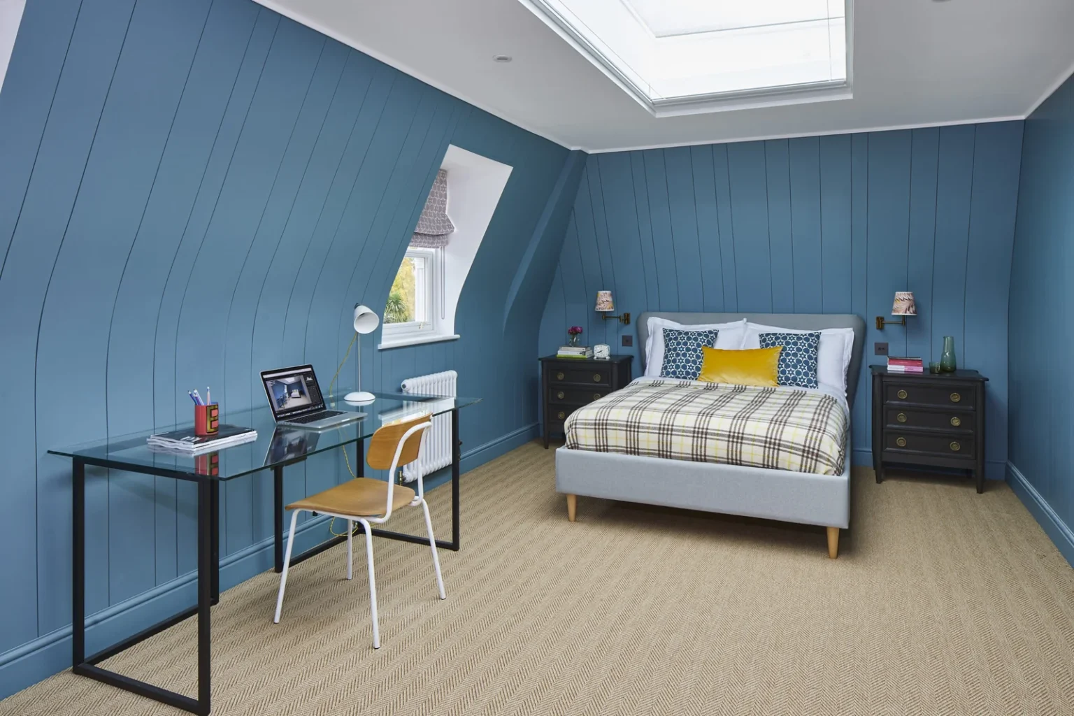 Loft conversion bedroom with blue panelled walls, skylight and desk - Stamford Brook W6