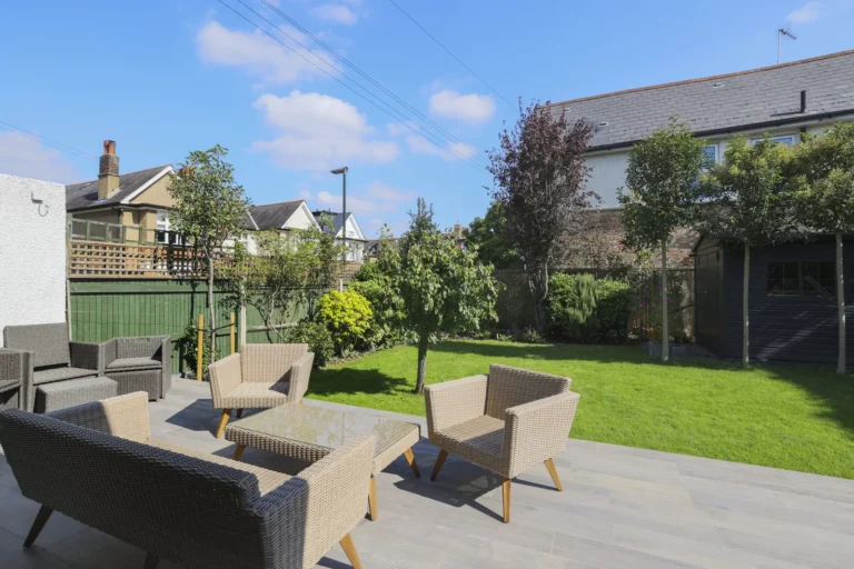 Cosy backyard patio with outdoor seating — Sheen SW14