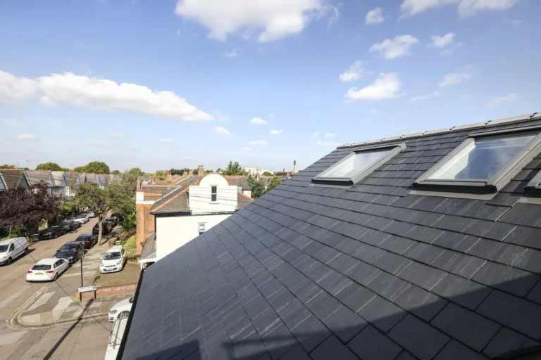 Residential neighborhood with rooftops and skylights, sunny day — Sheen SW14