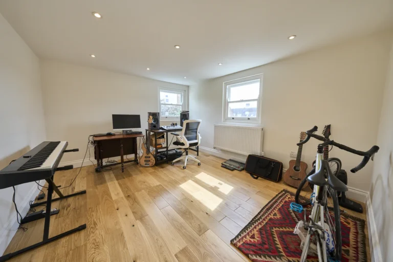 Home music studio with instruments and office setup — Kennington SE17