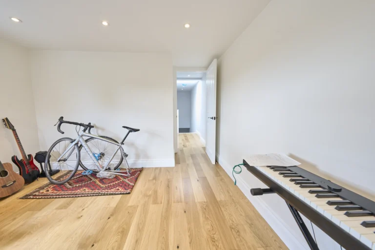 Room with bicycle, guitars, and electric keyboard — Kennington SE17