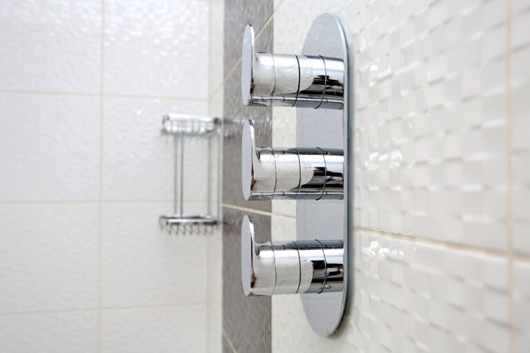 Chrome shower controls on textured bathroom wall β Morden SM4