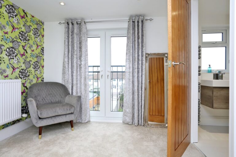 Bedroom with chair, floral wallpaper, French doors β Morden SM4