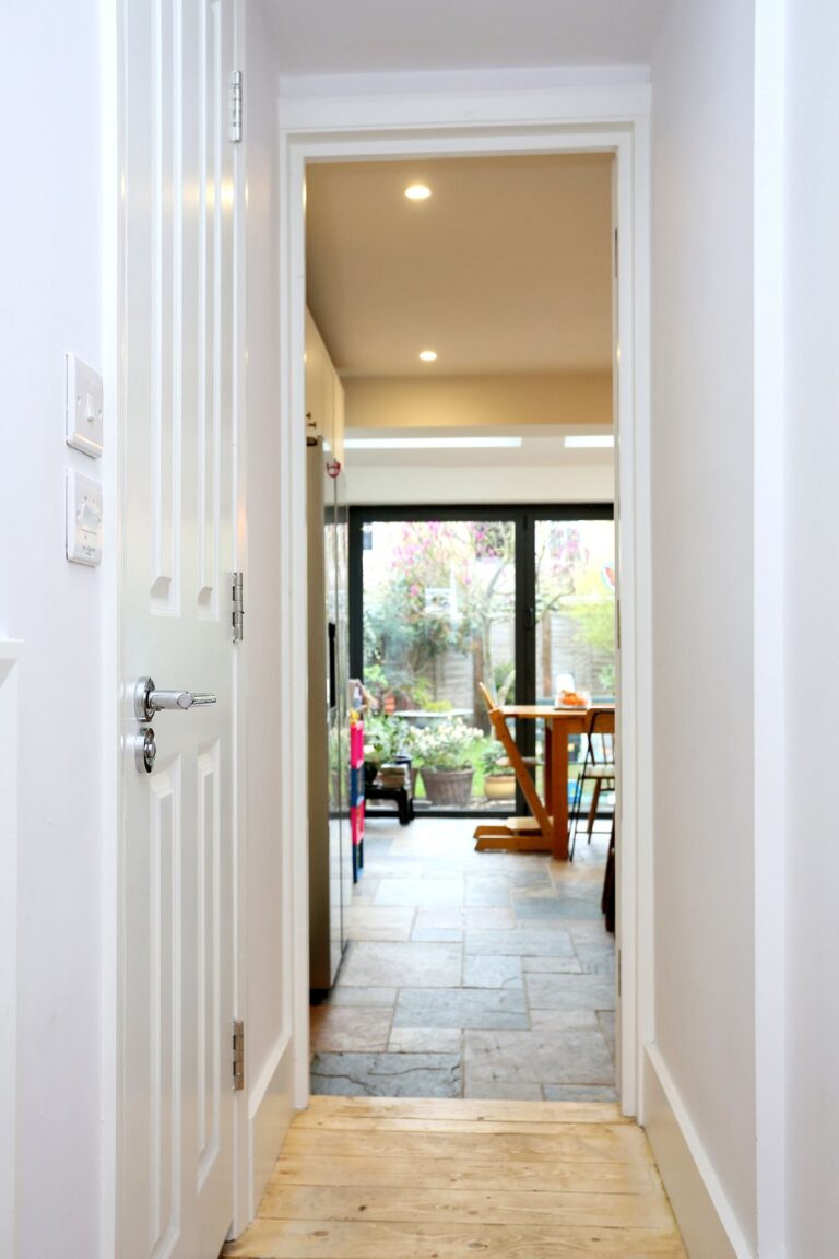 Hallway leading to garden-view kitchen area — Isleworth TW7