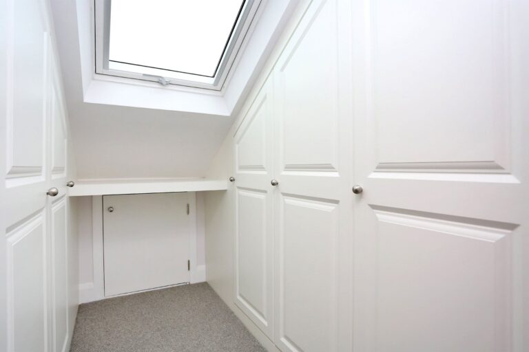 loft space with skylight and white cabinets — Isleworth TW7