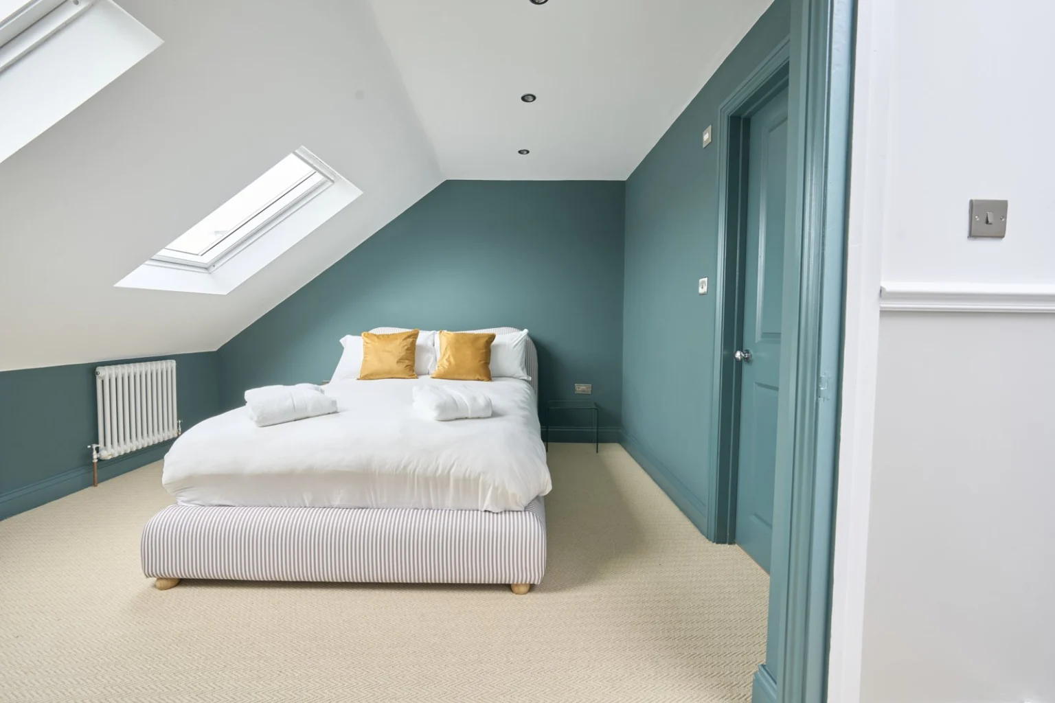 loft bedroom with skylight and Cosy decor — Balham SW12