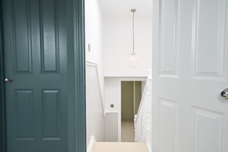 Bright hallway with blue and white doors — Balham SW12