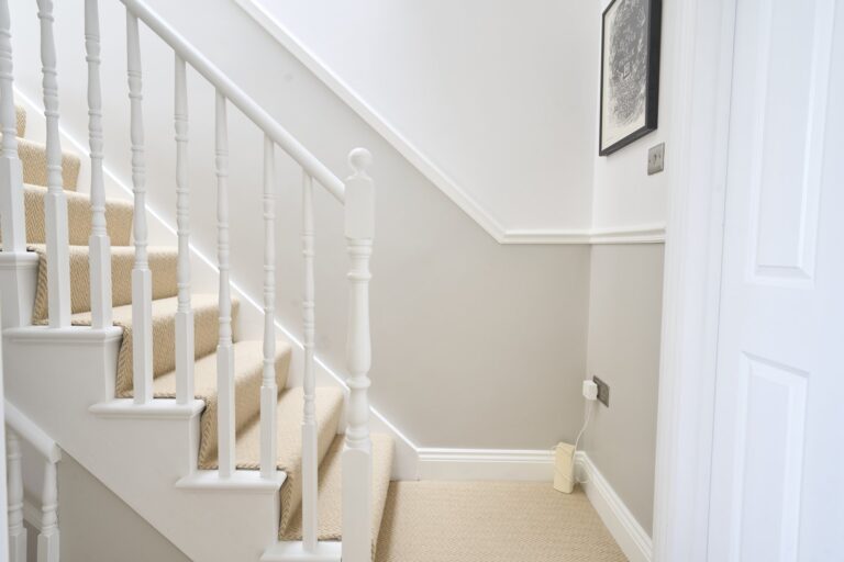White staircase corner with beige carpet — Balham SW12