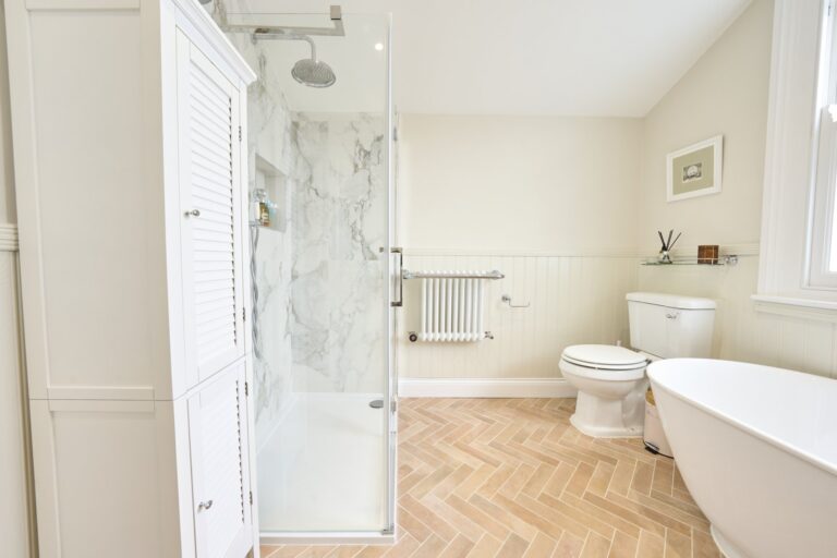 Modern bathroom with shower, tub, and toilet — Balham SW12
