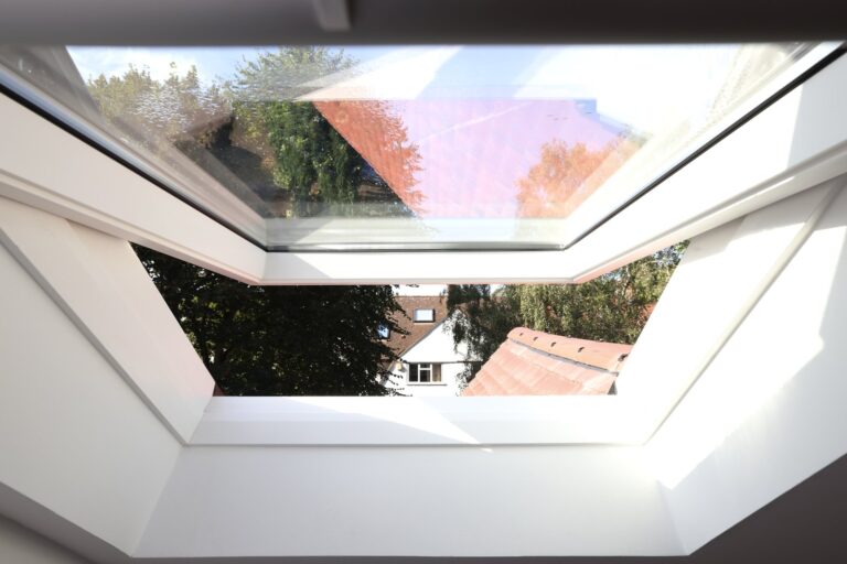 View through modern skylight and rooftop scene — Acton W3