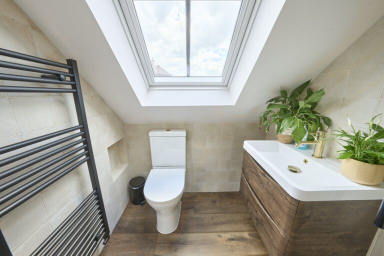 Modern bathroom with skylight and plants — Chiswick W4