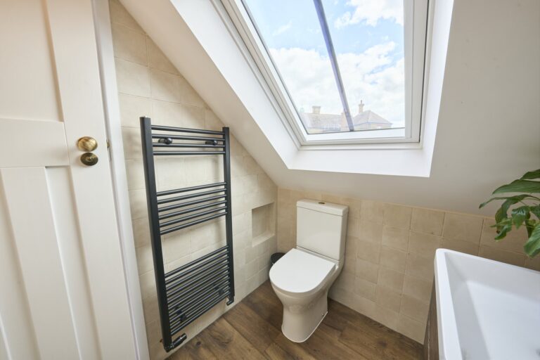 Modern bathroom with skylight and toilet — Chiswick W4