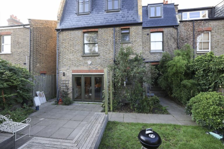 Brick townhouse with garden and patio area — Acton W3