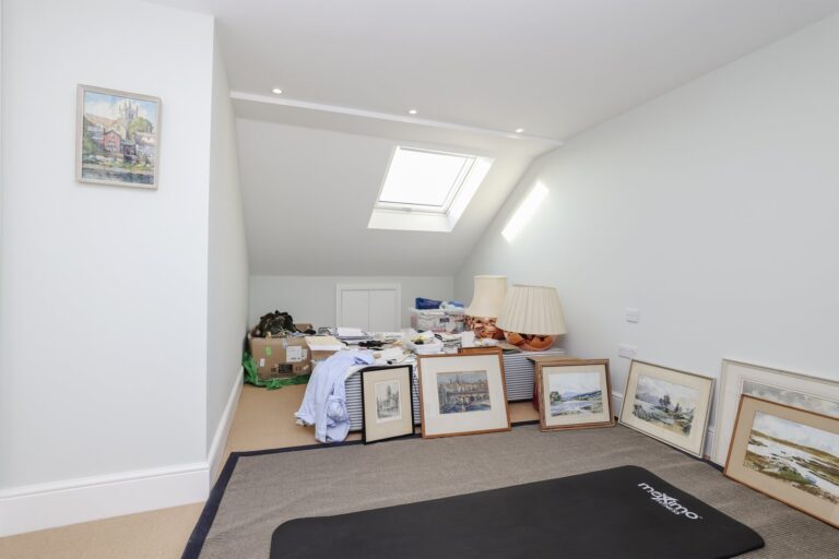 loft with artwork, boxes, and lighting — Acton W3