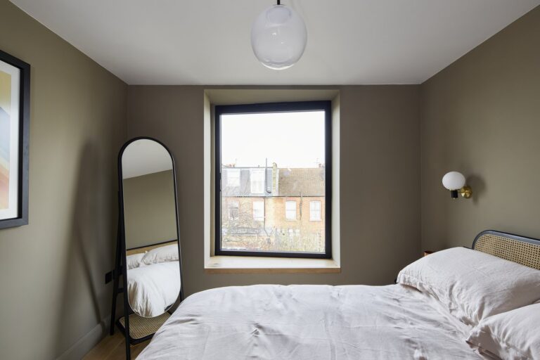 Cosy bedroom with a window and mirror view — Tooting SW17