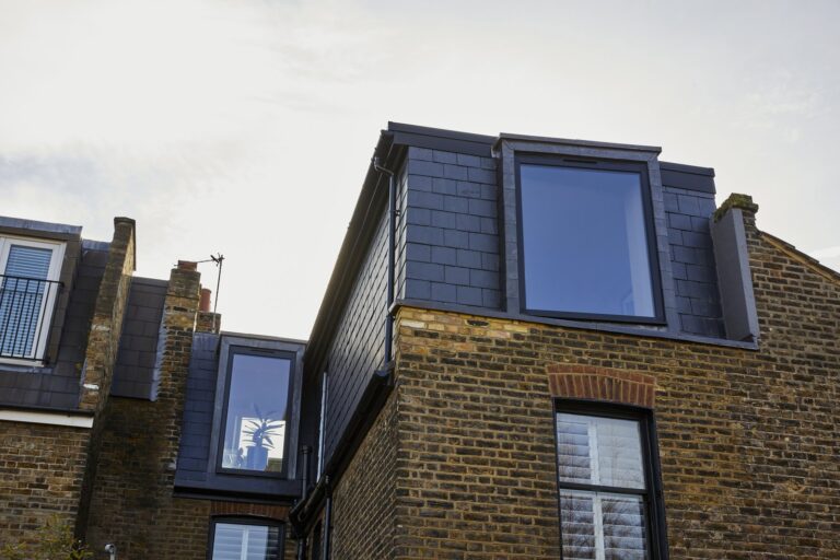 Modern loft conversion with large windows on brick building — Tooting SW17