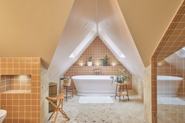 Modern loft bathroom with skylights and plants — Ealing W5