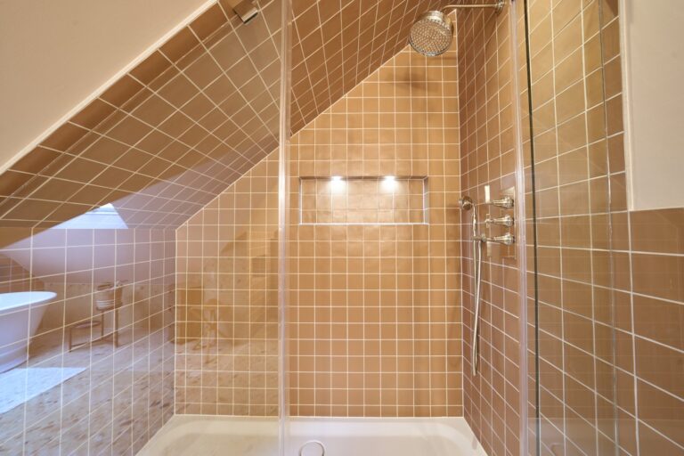 Modern loft shower with brown tiles — Ealing W5