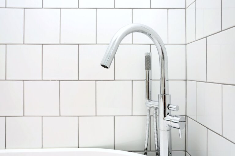 Modern chrome faucet with white tiled background — Fulham SW6