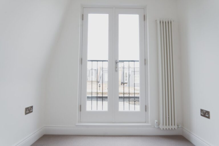 White French doors with balcony railings — Fulham SW6