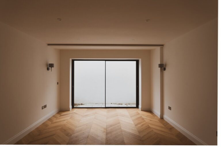 Empty room with large frosted glass doors — Fulham SW6