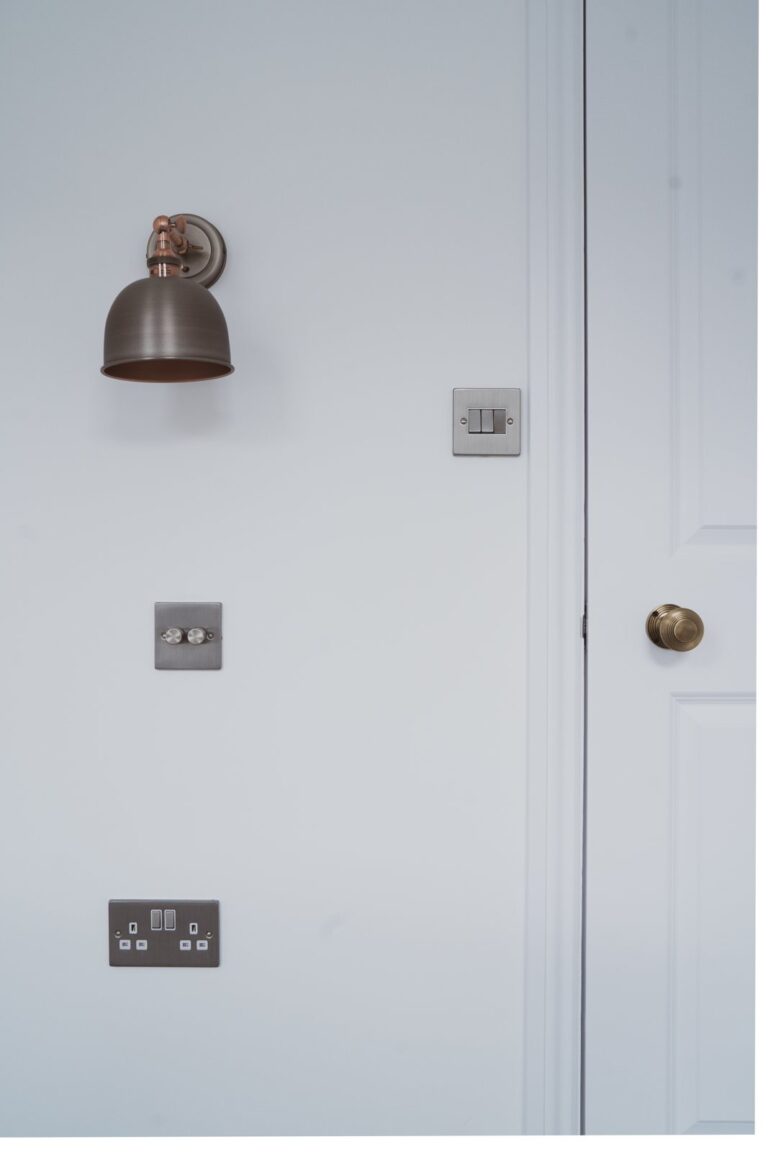 White wall with light switches and lamp — Fulham SW6
