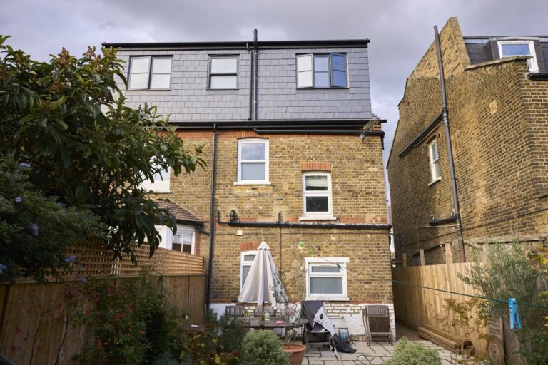 Backyard view of brick house with garden — Acton W3