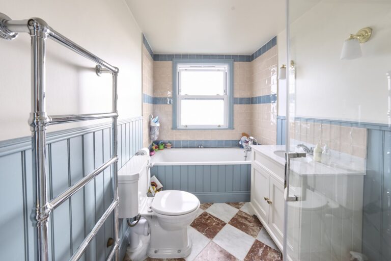 Classic bathroom with window, bathtub, and tiled walls — Acton W3