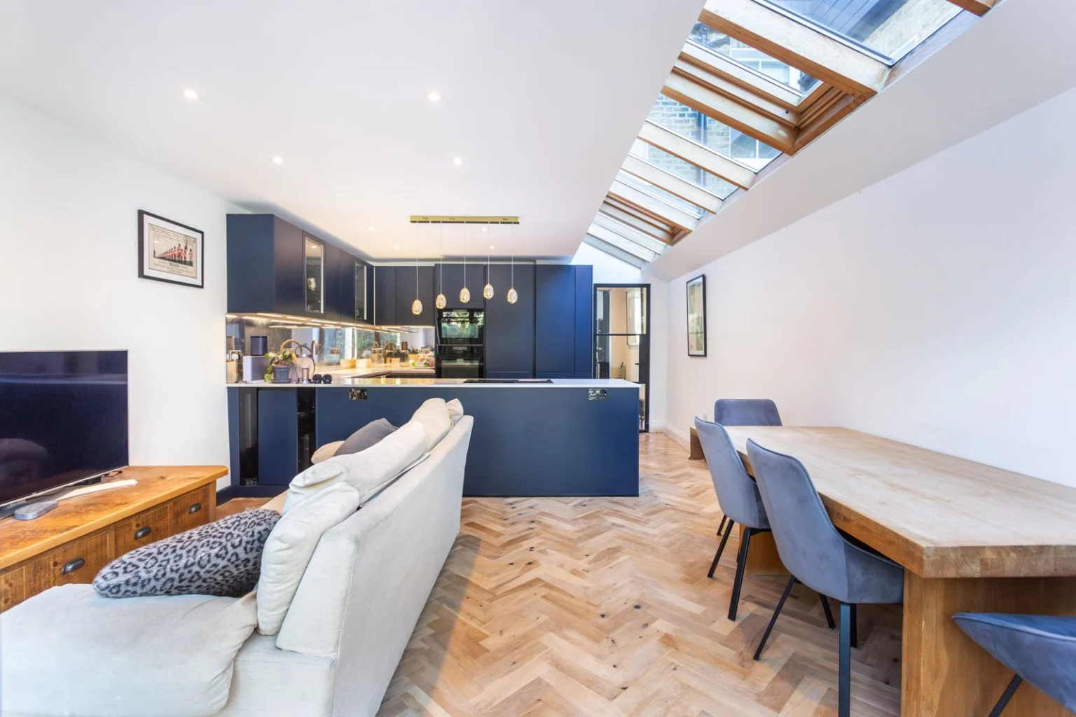 Modern open-plan kitchen and dining area with skylight — Balham SW12