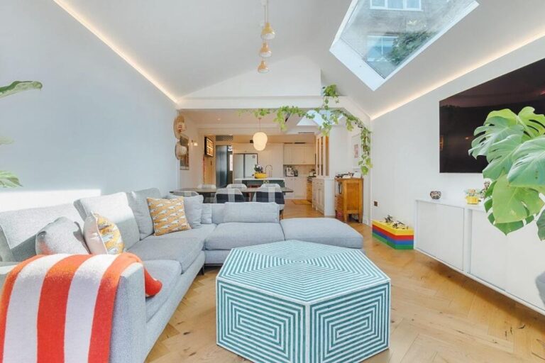 Modern living room with skylight and sectional sofa — Twickenham TW1